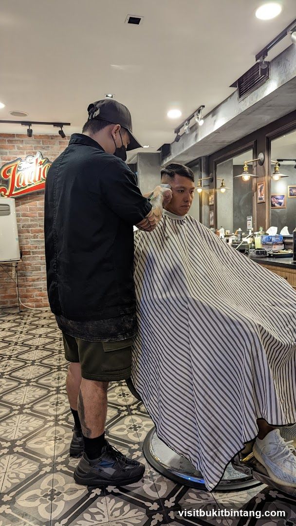 Barber cutting client's hair