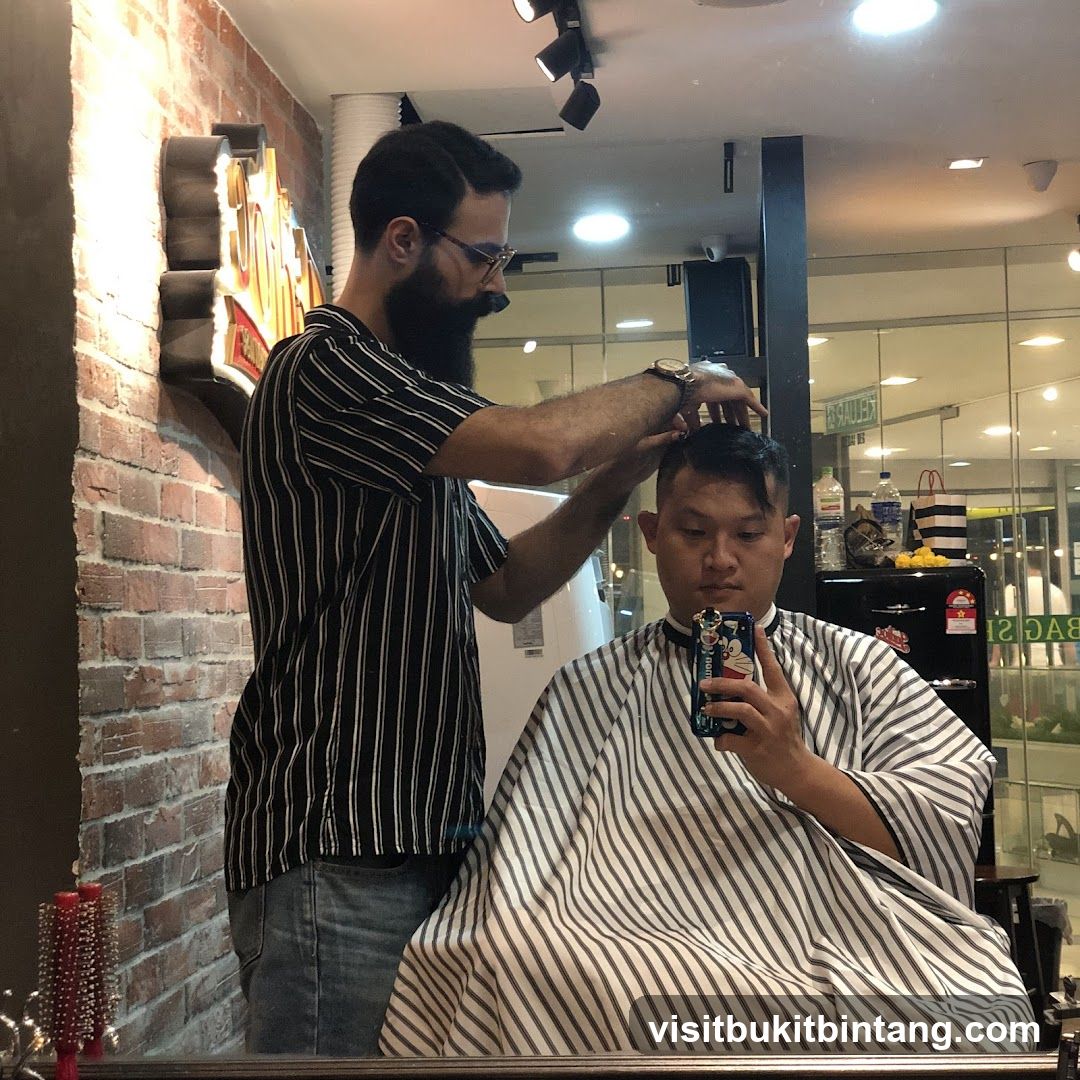 Barber cutting hair