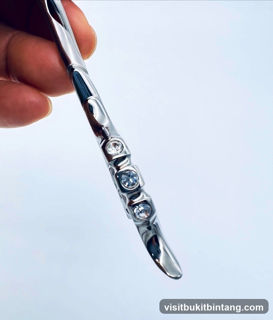 Close-up of a silver hair scissor with rhinestones