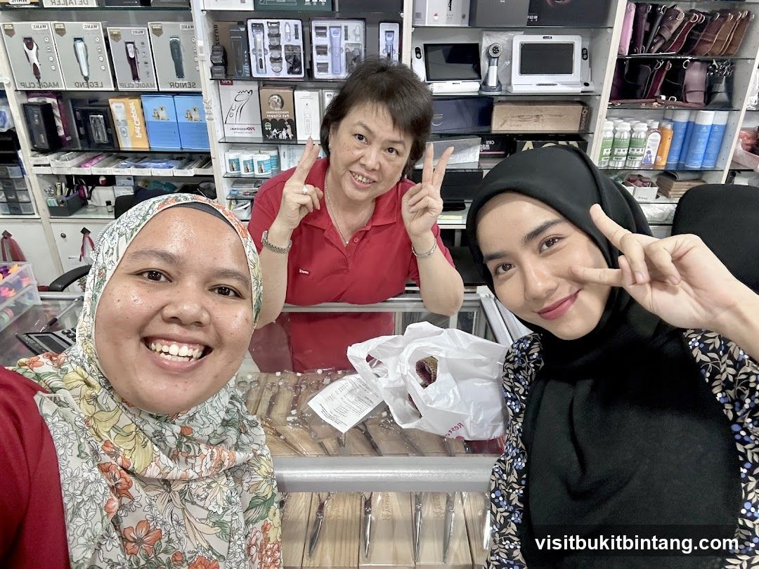 Three people posing for a selfie in a store