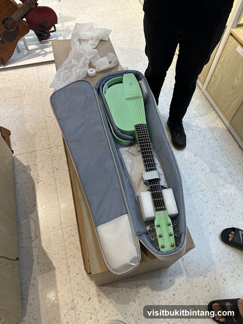 Unboxing a light green guitar
