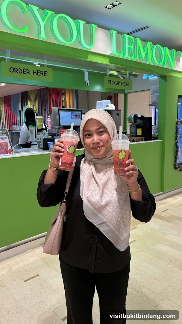 Woman holding drinks at a beverage counter