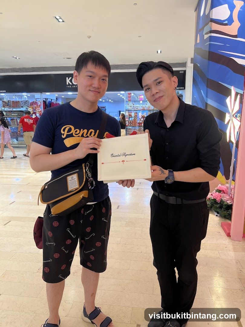 Two men holding a box