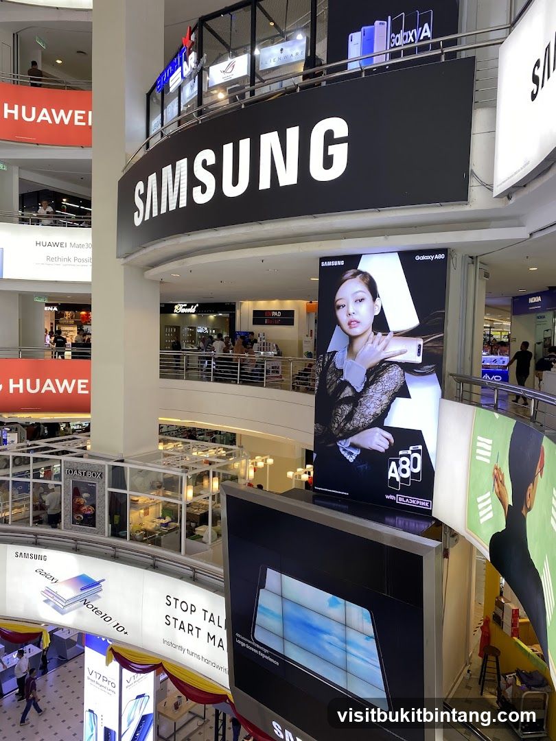 Samsung and Huawei advertisements in a mall
