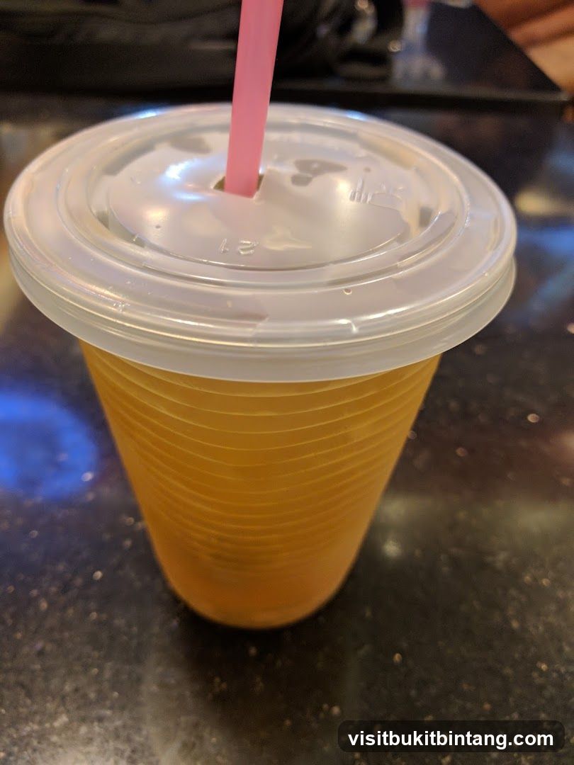 Orange Drink in a Plastic Cup