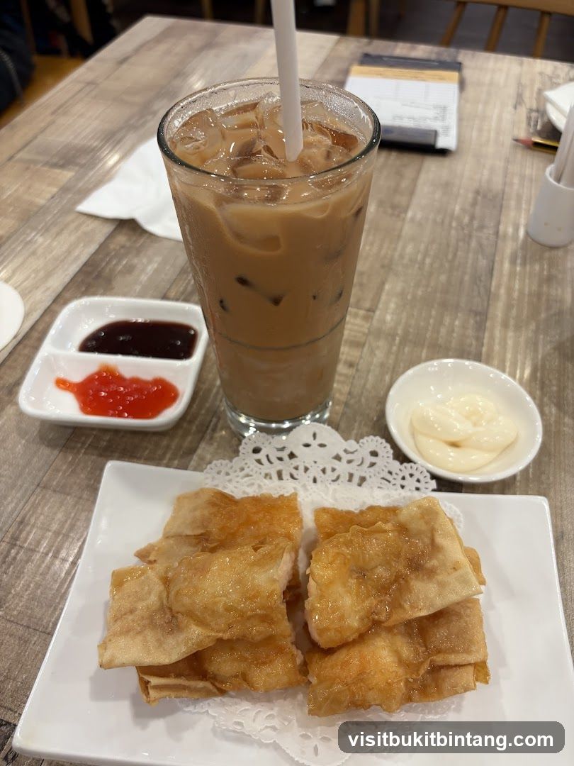 Fried Food with Iced Coffee and Condiments