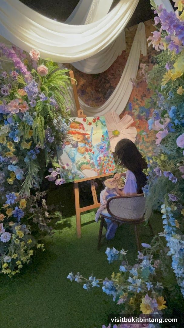 Artist painting in a floral setting