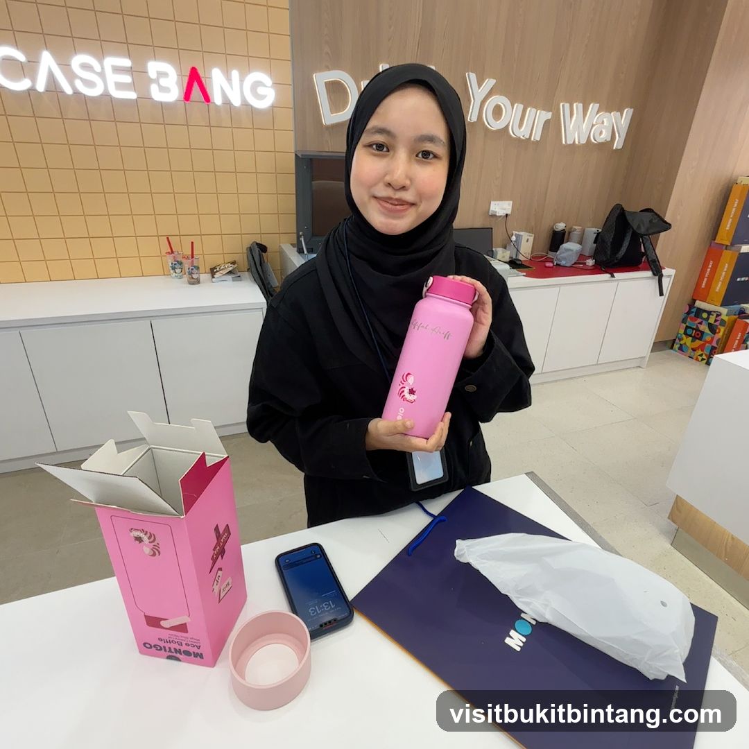 Woman holding a pink water bottle
