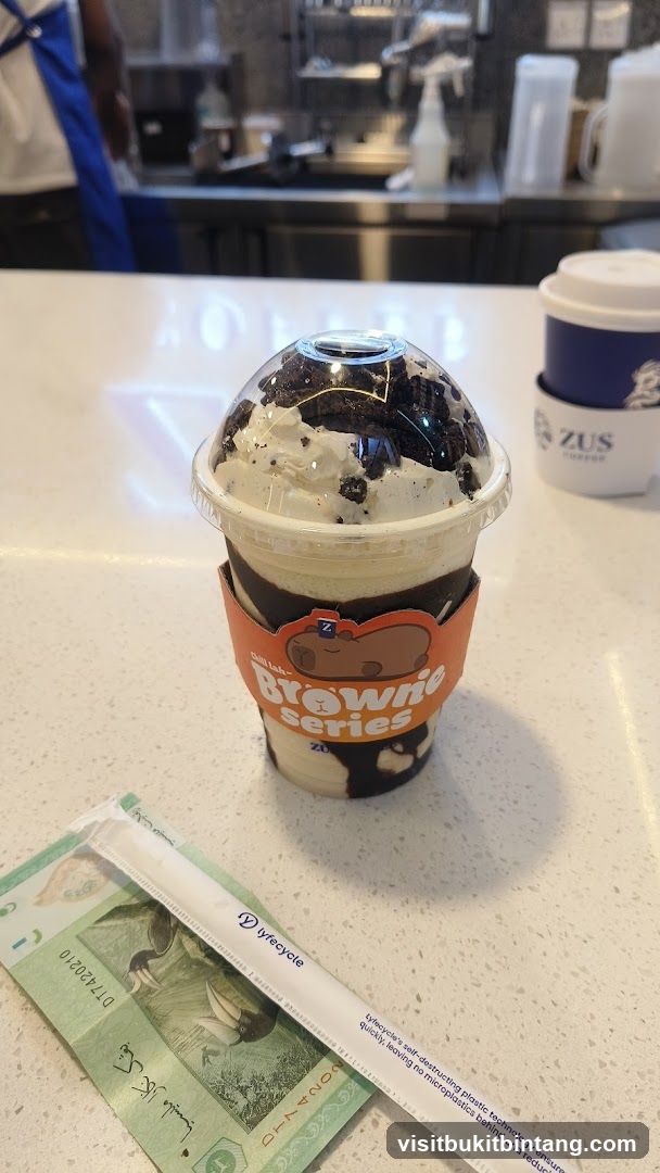 Dessert Drink with Money and Straw