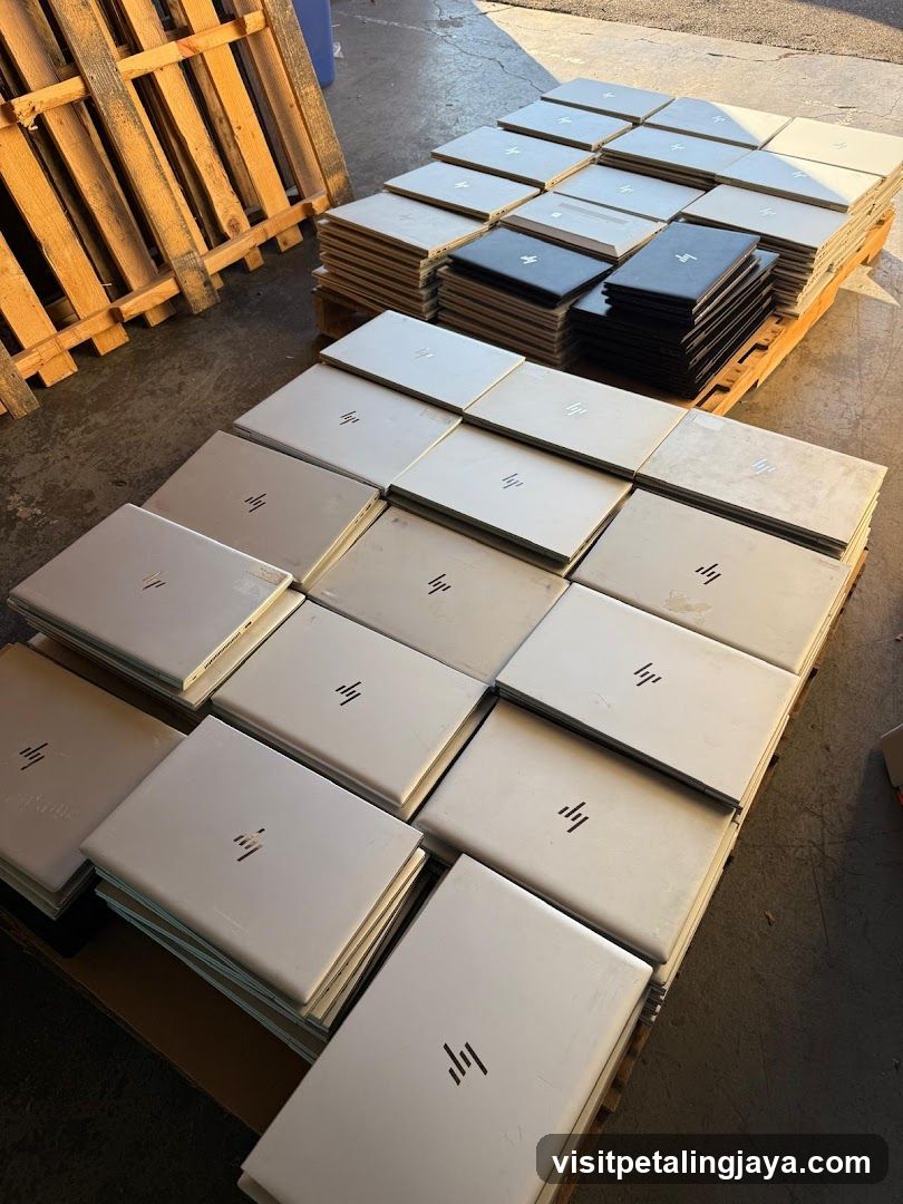 Stack of HP Laptops in Warehouse