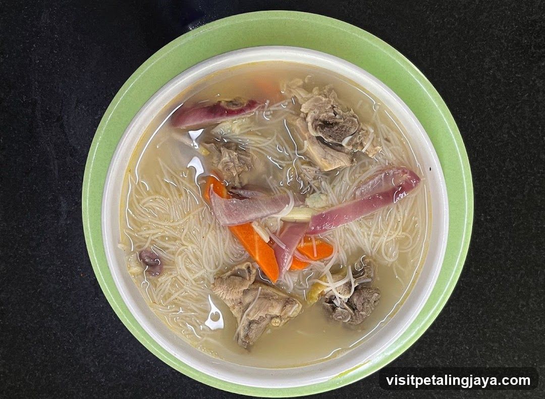 Bowl of Noodle Soup with Meat and Vegetables