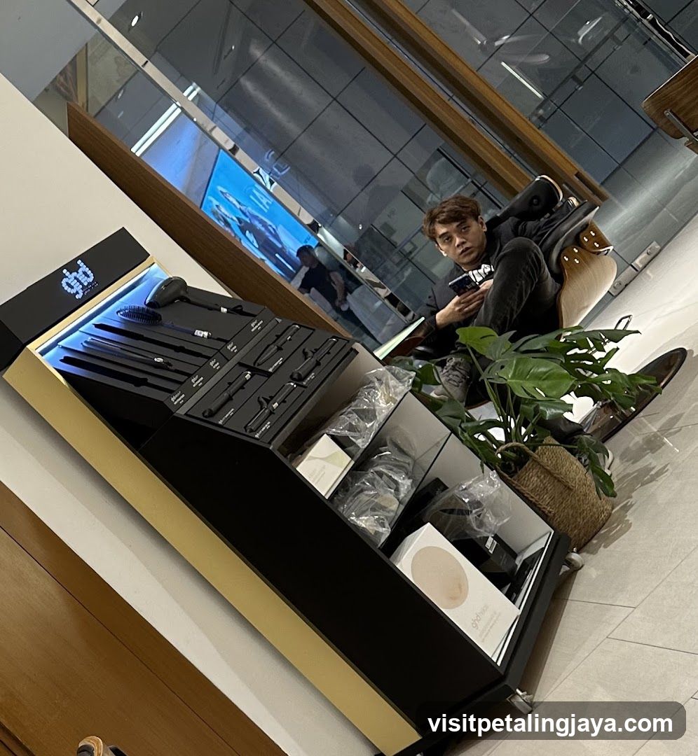 Electronics Display Counter with Seated Person