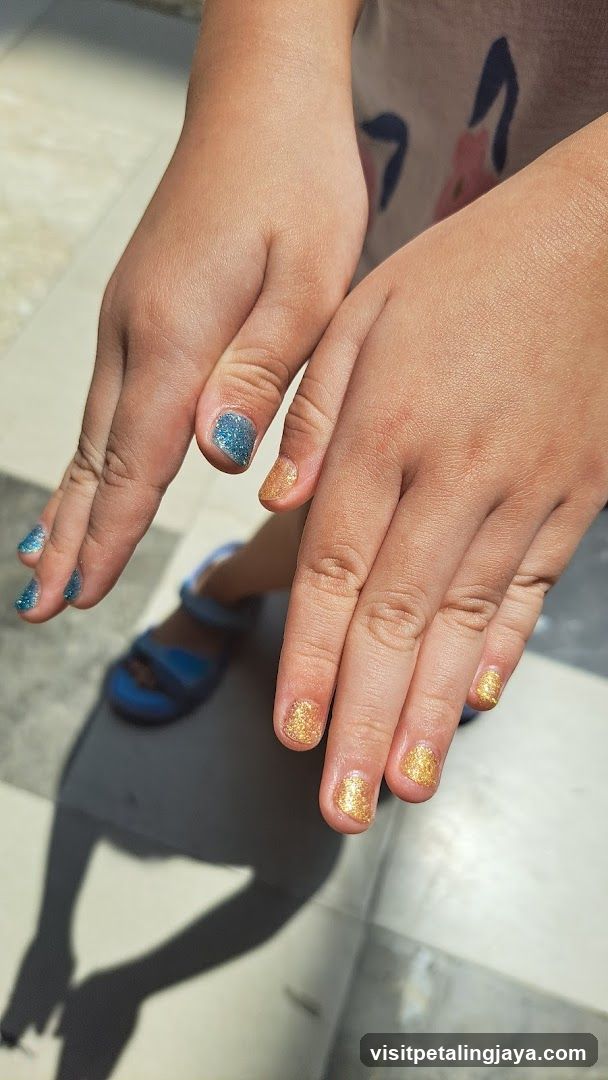 Child's Hands with Glitter Nail Polish