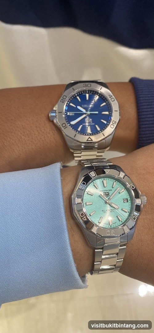 Two watches on wrists