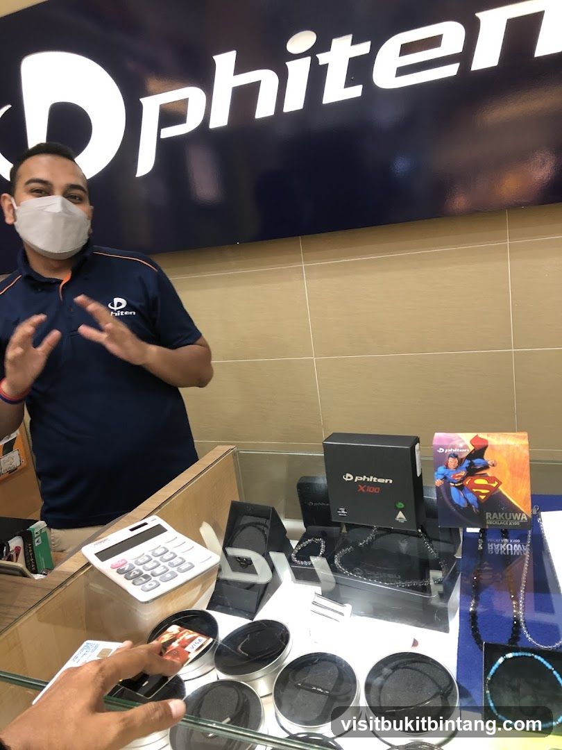 Store employee assisting customer