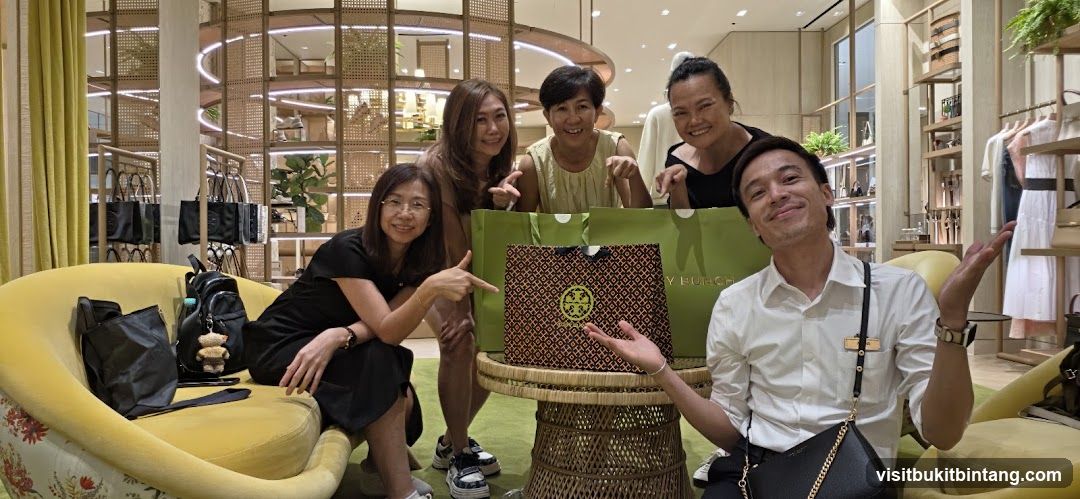 Group Posing with Shopping Bags