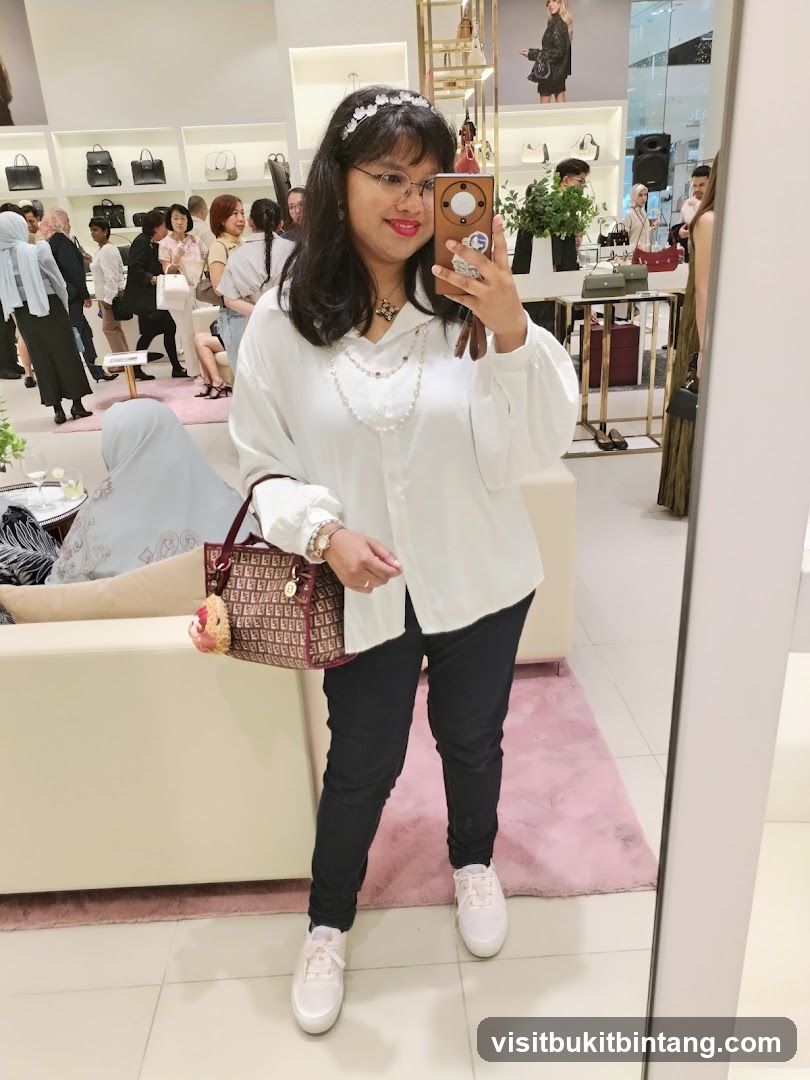 Woman taking a mirror selfie in a boutique