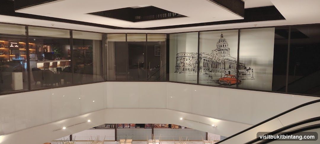 Interior of a building with a bar and a decorative window