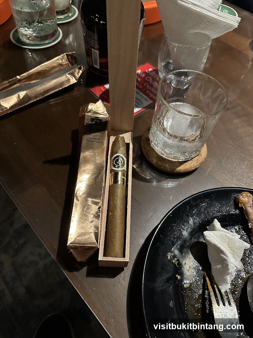Cigar and Drinks on Table