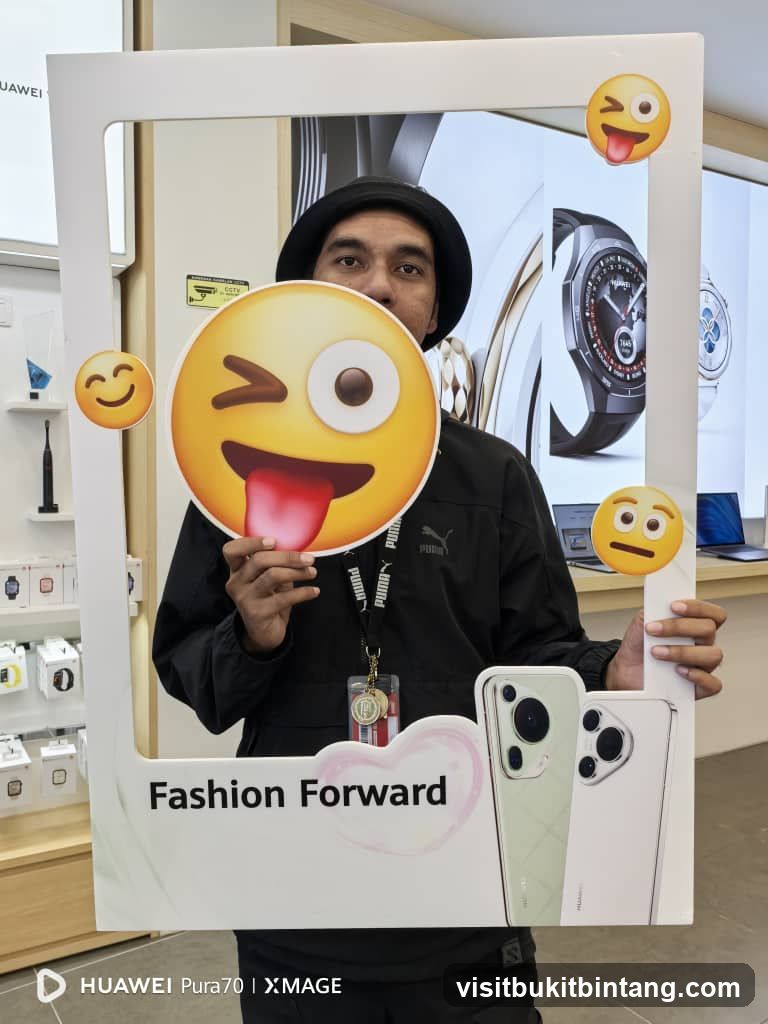 Man Posing with Photo Booth Frame