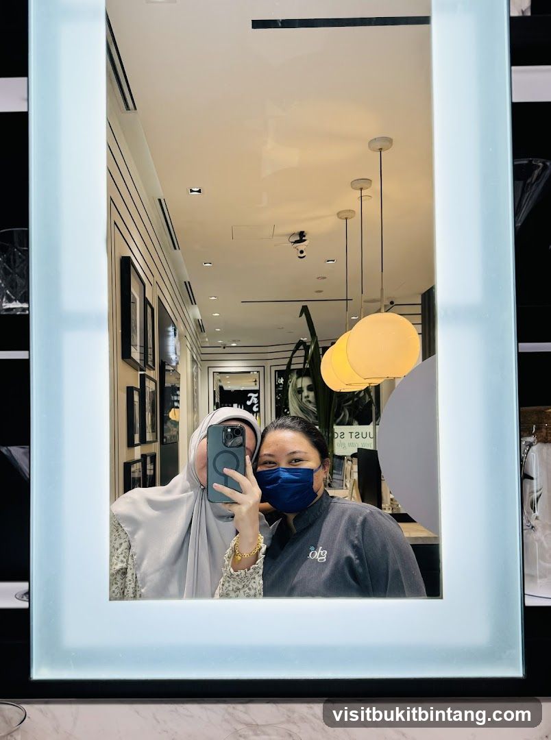 Two Women Taking a Mirror Selfie