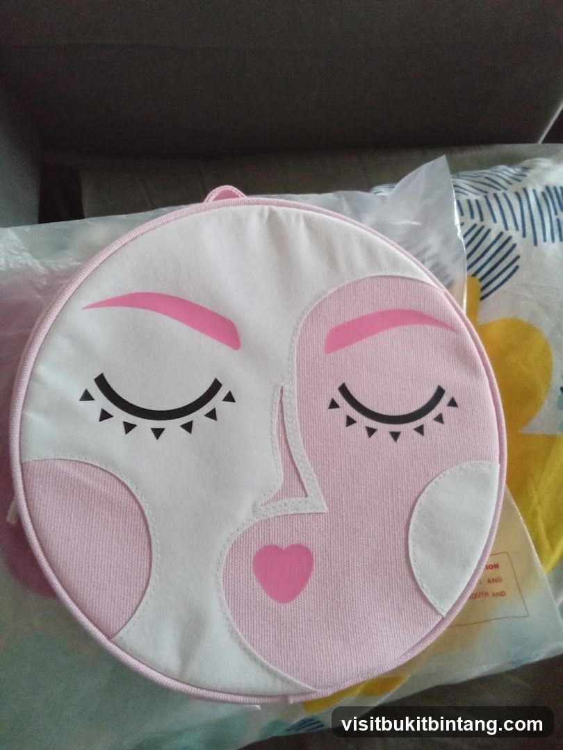 Round Pink Bag with Face Design