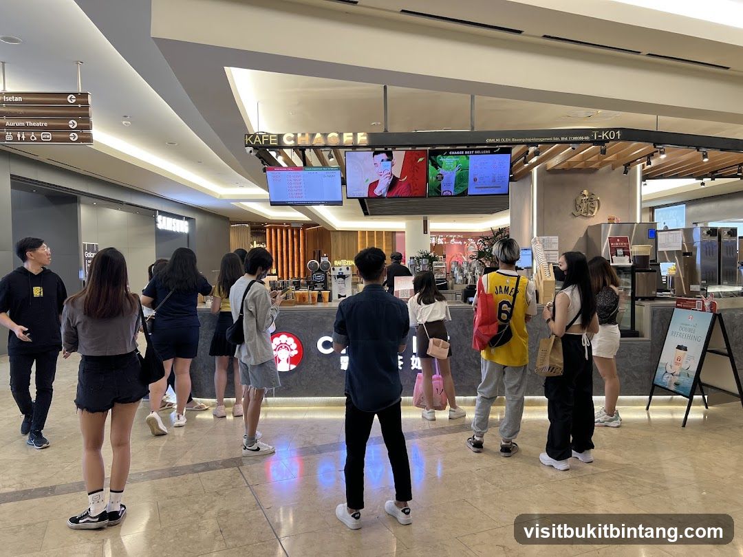 People queuing at a cafe