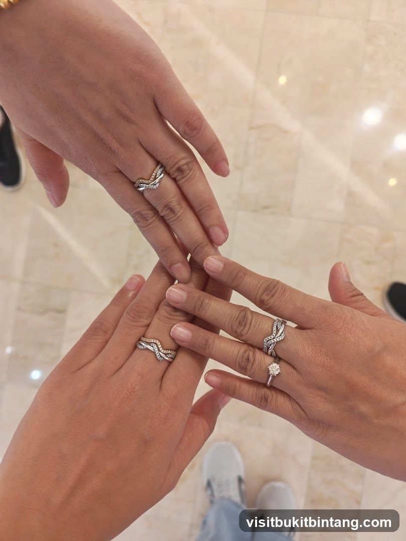 Three hands wearing rings