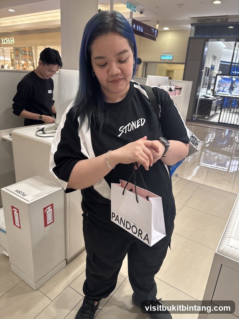 Woman holding a Pandora shopping bag