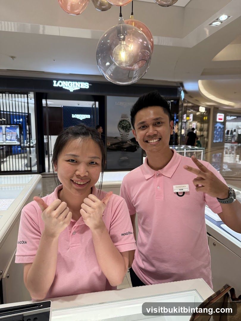 Two employees in pink shirts