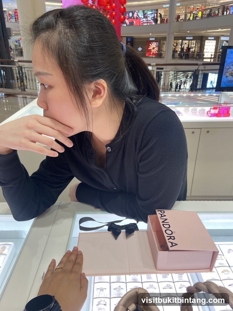Woman looking at jewelry display