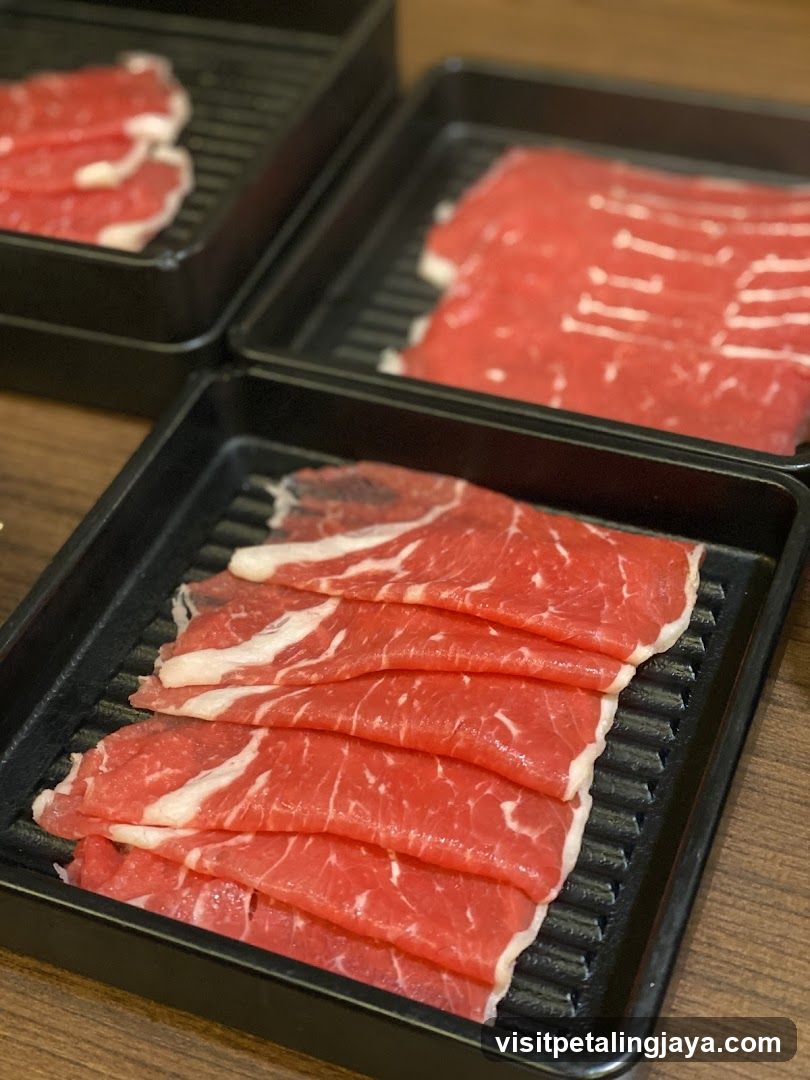 Raw Beef Slices on Grill Trays