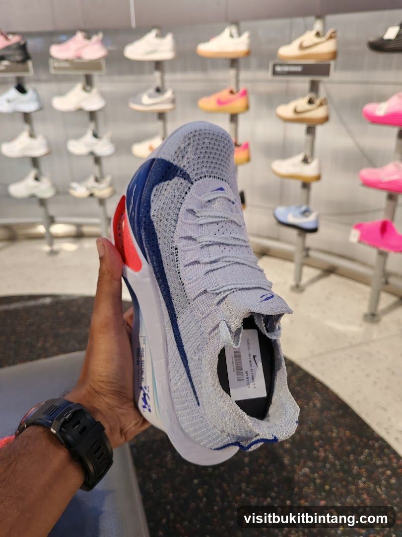 Man holding a Nike shoe
