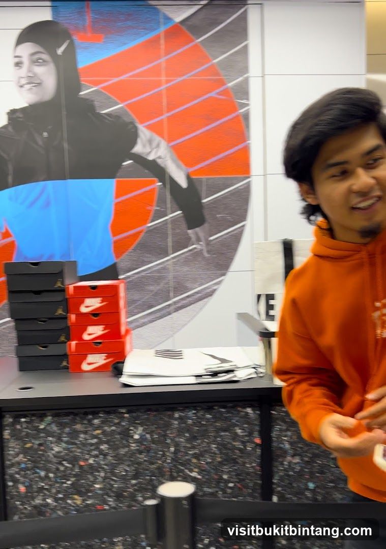 Man in Orange Hoodie at Nike Store