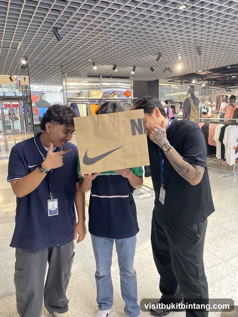 People holding a Nike shopping bag