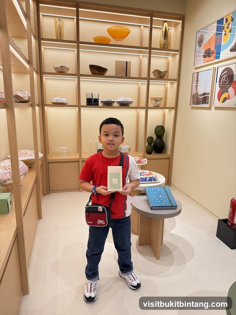 Boy holding a small box in a store