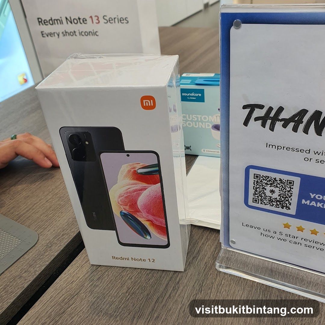 Redmi Note 12 Box and Promotional Sign