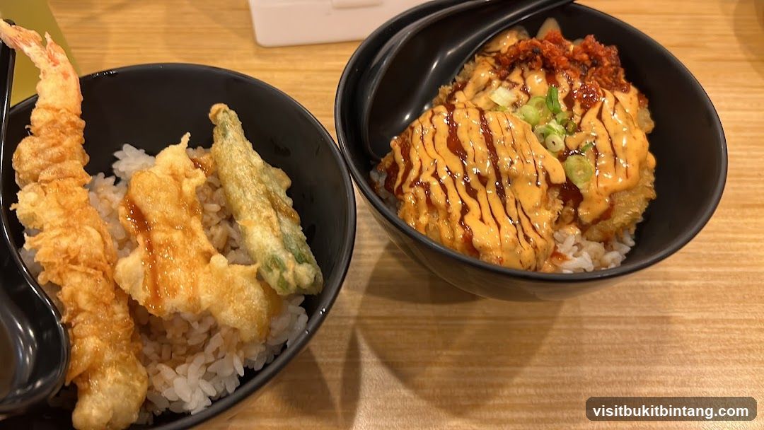 Two bowls of rice with toppings