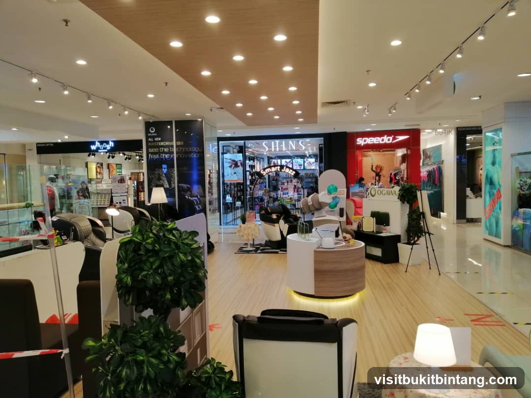 Shopping Mall Interior with Massage Chairs and Retail Stores