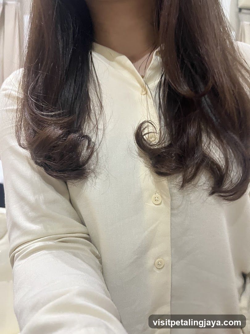 Person in Cream Button-Down Shirt