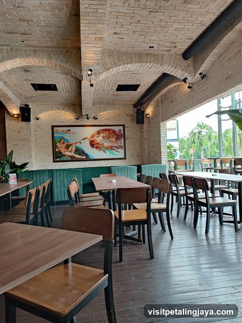 Interior of a restaurant with brick arches and artwork