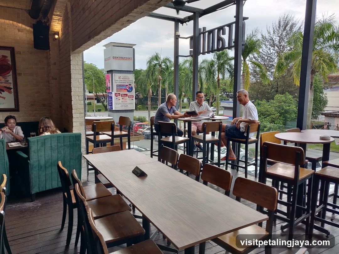 Outdoor Cafe Interior with Patrons
