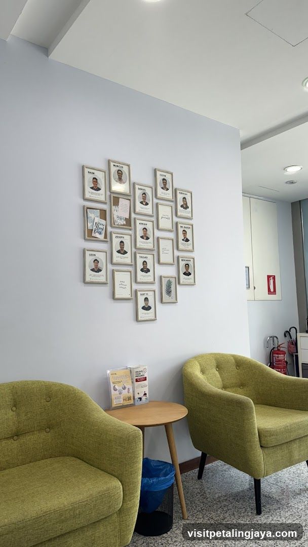 Lobby Interior with Staff Photos and Seating Area