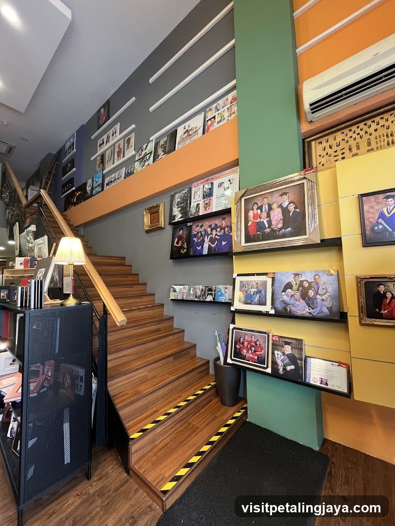 Interior of a shop with staircase and framed photos
