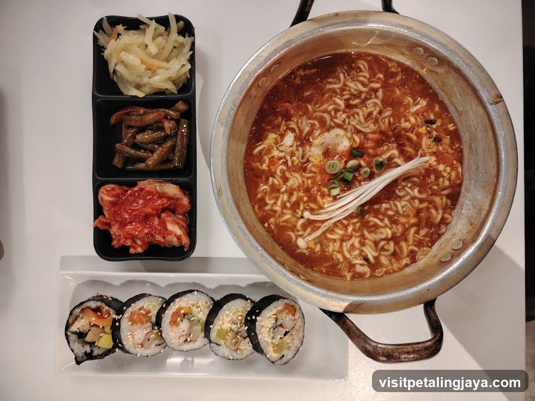 Korean-style meal with soup and sushi