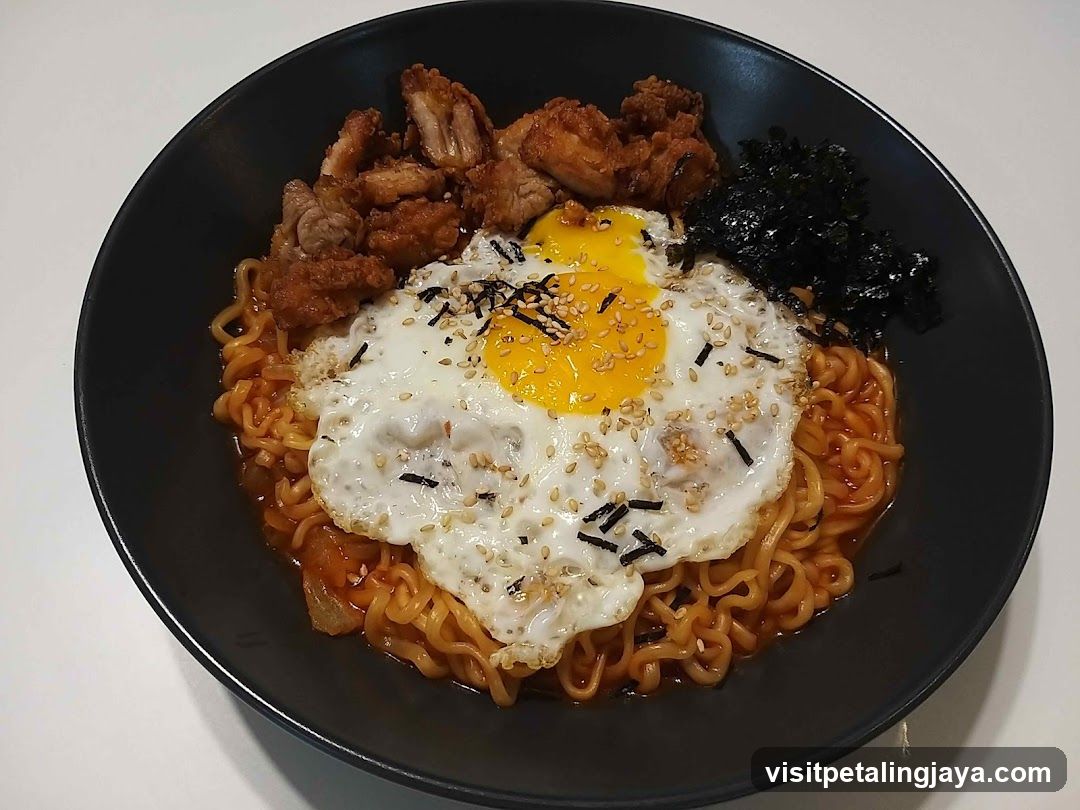 Bowl of Spicy Ramen with Fried Egg and Pork