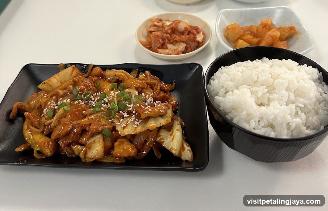 Korean-style stir-fry with rice and side dishes