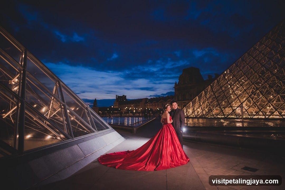 Couple in Red Dress at Louvre Pyramid Night
