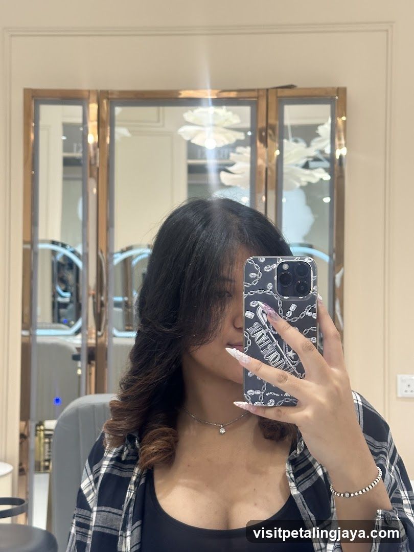 Mirror selfie in a salon or beauty shop interior