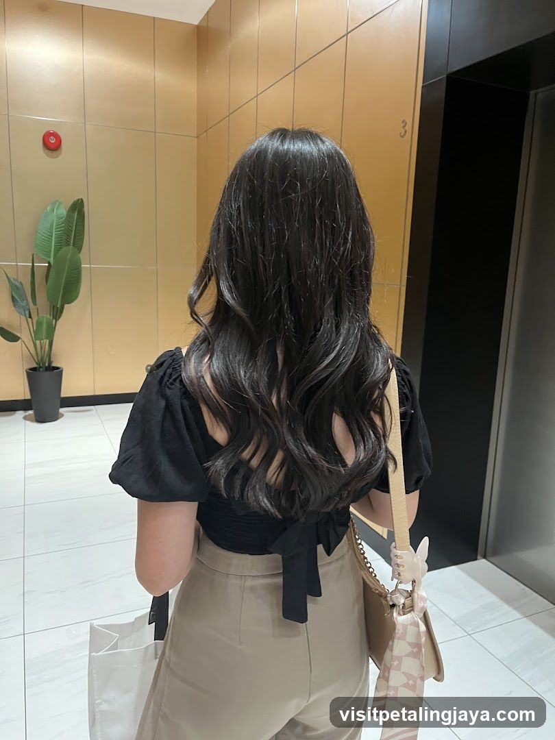 Woman with long wavy hair in hallway